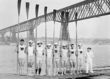 The University of Wisconsin varsity sport rowing team competing in the Intercollegiate Rowing Association regatta on June 11, 1914 at the Poughkeepsie Bridge. Wisconsin varsity rowing team at 1914 Poughkeepsie regatta.jpg