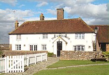 The Woolpack formerly West End farmhouse.