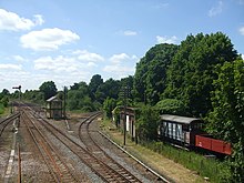 The signal box,Mid-Norfolk Railway line to the right,and old rolling stock. Pictured 2009 Wymondham box - geograph.org.uk - 1336010.jpg