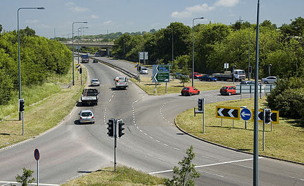 Signalised roundabout with the A4175 at Siston Common