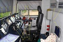 Cab of the boxcab-styled Russian locomotive 2TE116U. "11" indicates the throttle. 116U-rabmash.jpg