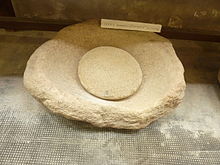 Nether millstone and knurling wheel found at the La Torche site (Plomeur) 156 Musee prehistoire Penmarc'h.JPG