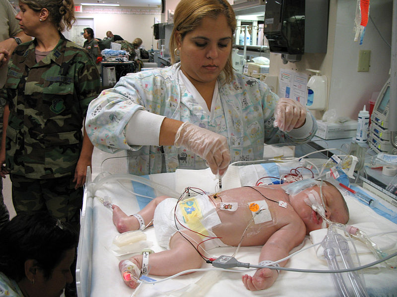 File:A Resperatory Therapist treating a newborn child Pulaski County Technical College Respiratory Therapist Program.jpg