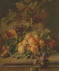 Peaches, melon and grapes on a ledge