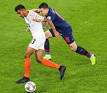 Kuruniyan in action against Thailand national football team in the 2019 AFC Asian Cup.