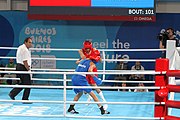 Deutsch: Boxen bei den Olympischen Jugendspielen 2018 Tag 12, 18. Oktober 2018 - Kampf um Bronze im Leichten Weltergewicht Jungen – Hassan Azim (Großbritannien, rot) schlägt Mohammed Boulaouja (Marokko, blau) RSC; Ringrichter ist Wulfren Olivares Peréz (Kolumbien). English: Boxing at the 2018 Summer Youth Olympics on 18 October 2018 – Bronze Medail Match Light Welterweight Boys - Hassan Azim (Great Britain, red) beats Mohammed Boulaouja (Morocco, blue) RSC; Referee is Wulfren Olivares Peréz (Columbia). Español: Boxeo en los Juegos Olímpicos Juveniles de Verano de 2018 en 18 de octubre de 2018 - Medalla de bronce de los hombres ligeros de peso welter: Hassan Azim (Gran Bretaña, rojo) vence a Mohammed Boulaouja (Marruecos, azul) RSC; El árbitro es Wulfren Olivares Peréz (Colombia).