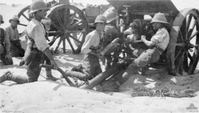 British artillerymen loading an 18 pounder gun at Romani in 1916