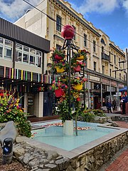 Cuba Street is considered the microcosm of Wellington's culture, being "quirky" and packed with retail and art, such as the Bucket Fountain (pictured). Bucket Fountain with flowers.jpg