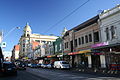 shopping strip, mostly two storey retail stores