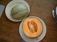 A Charentais melon hybrid with somewhat netted skin, split in half Charentais-Melone.jpg