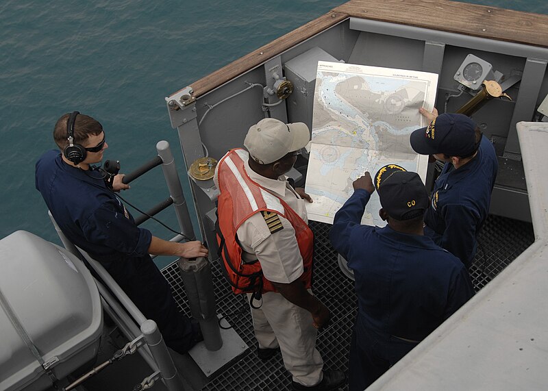 File:Darryl Brown, commanding officer of USS Robert G. Bradley (FFG 49), talks with a Nigerian pilot while navigating into Lagos.jpg