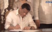 President Rodrigo Duterte signs the Philippine Space Act (RA 11363), August 2019 Duterte establishing the Philippine space agency.png