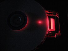 DVD-RW Drive operating (performing a burning (writing) operation) with its protective cover removed Dvd-burning-cutaway3.JPG