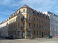 Apartment house in a corner and closed development