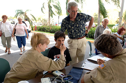 Federal Emergency Management Agency (FEMA) Disaster Medical Assistance Team checks a patient outside of the JFK Medical Center (Boynton Beach). The DMAT is set up in the entryway of the hospital to assist in seeing the increase flow of patients due to Hurricane Wilma.