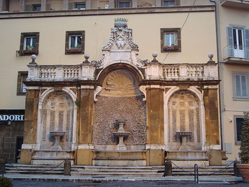 Fountain in Piazza San Pietro surmounted with the papal crossed keys