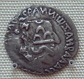 A coin of Nahapana overstruck by the Satavahana king Gautamiputra Satakarni. Nahapana's profile and coin legend are still clearly visible. Gautamiputra Sri Satakarni overstruck on a coin of Nahapana.jpg