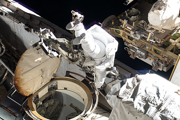 ISS-59 EVA-2 (a) Christina Koch exits the Quest airlock