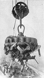 Industrial electromagnet lifting scrap iron, 1914 Industrial lifting magnet.jpg