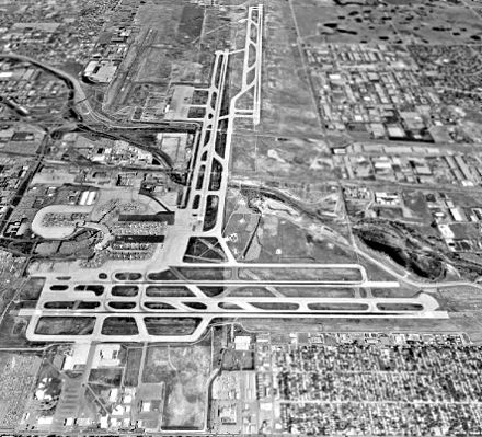 USGS photo of Stapleton International Airport looking north, June 1993, shortly before its closure. Runway 17R/35L crosses Interstate 70 at its midpoint.