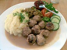 Beef and pork meatballs (lihapullat), served with mashed potatoes, creamy roux sauce, salad, and lingonberry jam KahvilaSuomi Meatballs.JPG