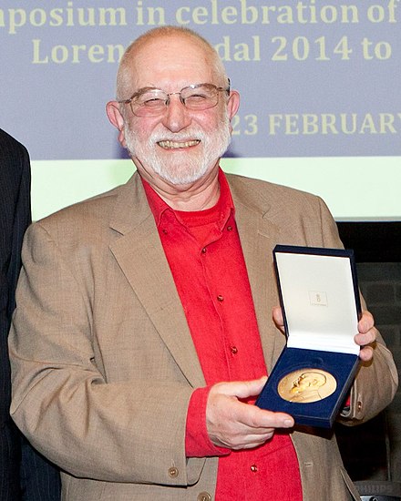 Michael Berry holding Lorentz Medal