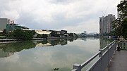 A river on a clear sky along a esplanade.