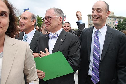 Outside the Supreme Court on the morning of June 26, 2015, James Obergefell (foreground, center) and attorney Al Gerhardstein (foreground, left)[17][18] react to its historic decision.
