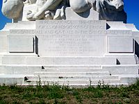 The inscription in the slab, at the pedestal of the monument, in the rear side. The front side inscription is in French