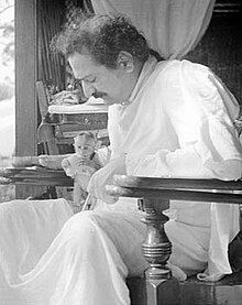 Mystic and spiritual master Meher Baba with his pet monkey named Lucky in India (c. 1940). The monkey had been given to him by Princess Norina Matchabelli. Meher Baba 1939.jpg