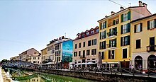 The Naviglio Grande, which hosts several shops and cafes, but is especially famous for its thriving night-time clubbing and discotheque scene. Naviglio Grande in Milan in Italy.jpg