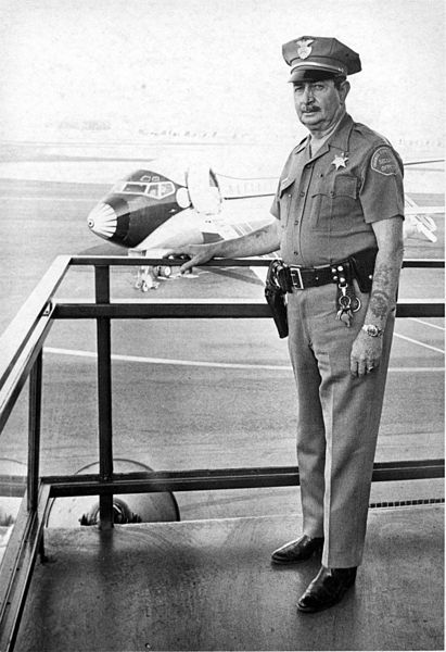 File:Orange County Airport, security officer, Sept. 1970.jpg