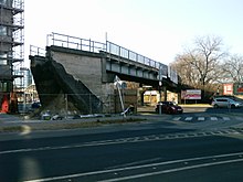 A former railway bridge over the Vaci ut in Ujpest, Budapest, Hungary - with its rail line defunct in the early 1990s, the cityside approach of the bridge was demolished to create space for construction. Overpass bridge, Vizafogo railway.jpg