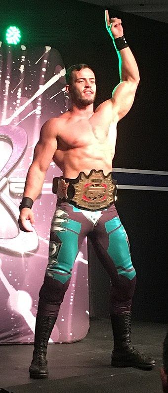 Austin Theory wearing the FIP World Heavyweight Championship in 2018