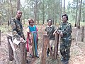 Environmentalist Rachel Nyakeri and Wildlife Society officials identify invasive vegetation