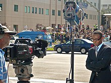 Reporter covering the death of Michael Jackson outside UCLA Medical Center in Los Angeles Reporter and Crowd outside UCLA - MJ Death.jpg