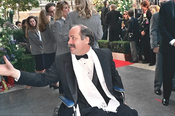 Ron Kovic attending the 62nd Academy Awards on March 26, 1990. He and Stone received an Oscar nomination for Best Adapted Screenplay and won a Golden 