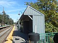 Close-up shot of the wooden platform shelter on the Oyster Bay-bound platform.