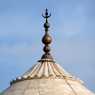 Finial element marking the top or end of some object; decorative feature