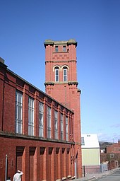 The mill known locally as The Mop Shop. Industrial textile manufacturing was introduced to Heywood in the late 18th century and by 1833, the town had 27 cotton mills