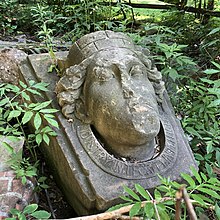 A keystone from the former Toronto Custom House (1845-1909) bearing the image of "Lady Toronto". The old city motto is emblazoned around her neck and the city's Crown Mural rests on her head. The keystone is now part of "Marsh Fountain" by artist Gene Threndyle, located in Dufferin Grove Park. Toronto Custom House Lady Toronto.jpg