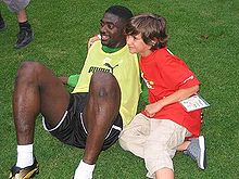 Toure With a Young Fan.jpg