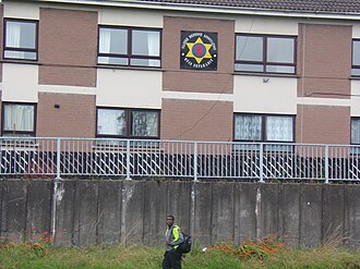 A UDA sign on the front of 2-storey flats in Ballykeel 1 UDA sign Ballykeel.JPG