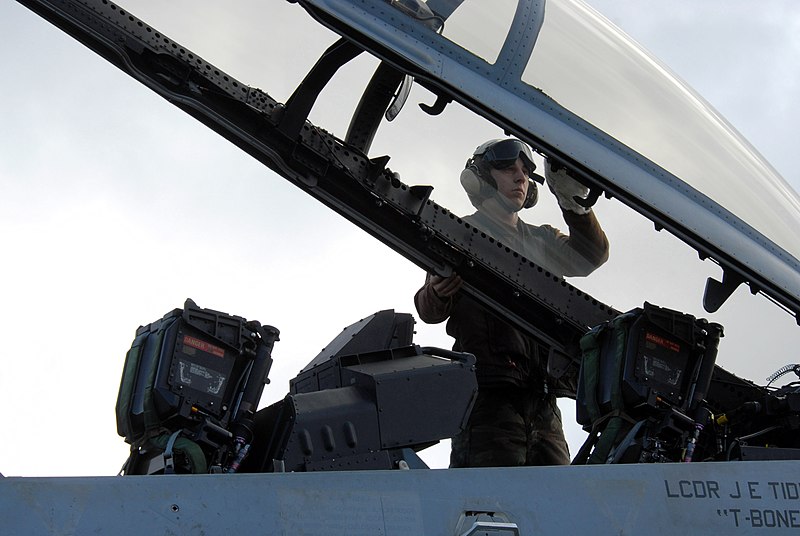 File:US Navy 070317-N-3659B-148 Plane captain Aviation Machinist's Mate Airman Rodney Hunter, from Cleveland, Ohio, cleans the canopy and prepares an F-A-18F Super Hornet.jpg