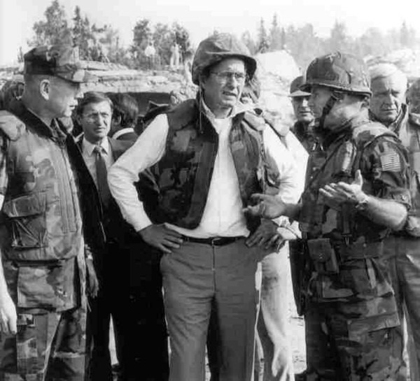 Marine Gen. P.X. Kelley (left) and Col. Tim Geraghty (right) take Vice President George H. W. Bush on a tour of the Beirut barracks bombing, two days 