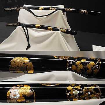 Black lacquered hanamaru mon maki-e raden daishō koshirae. Meiji period.
