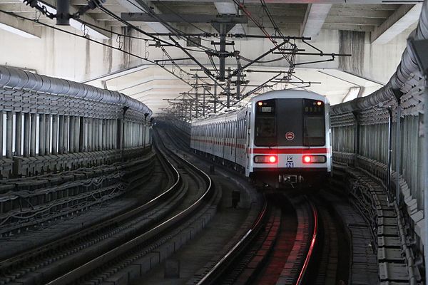 Line 1 train running under the North–South Elevated Road.