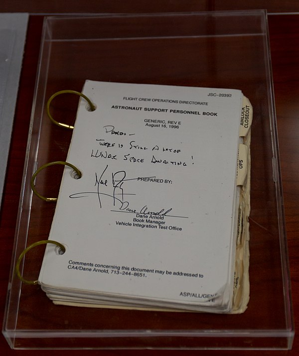 Melroy's Astronaut Support Personnel Book with a message from Neil Armstrong