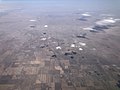 2022-03-24 18 16 53 UTC minus 6 View north along U.S. Route 85 in western Weld County, Colorado and southern Laramie County, Wyoming, with the town of Nunn (lower center) and city of Cheyenne (top) visible.jpg