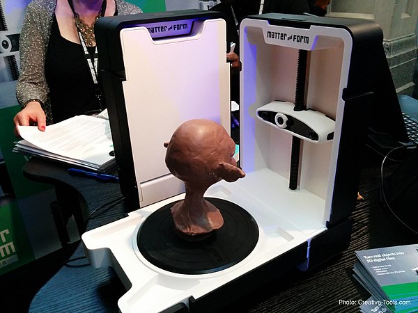 A 3D Scanner that photographs objects as they move on a turntable.